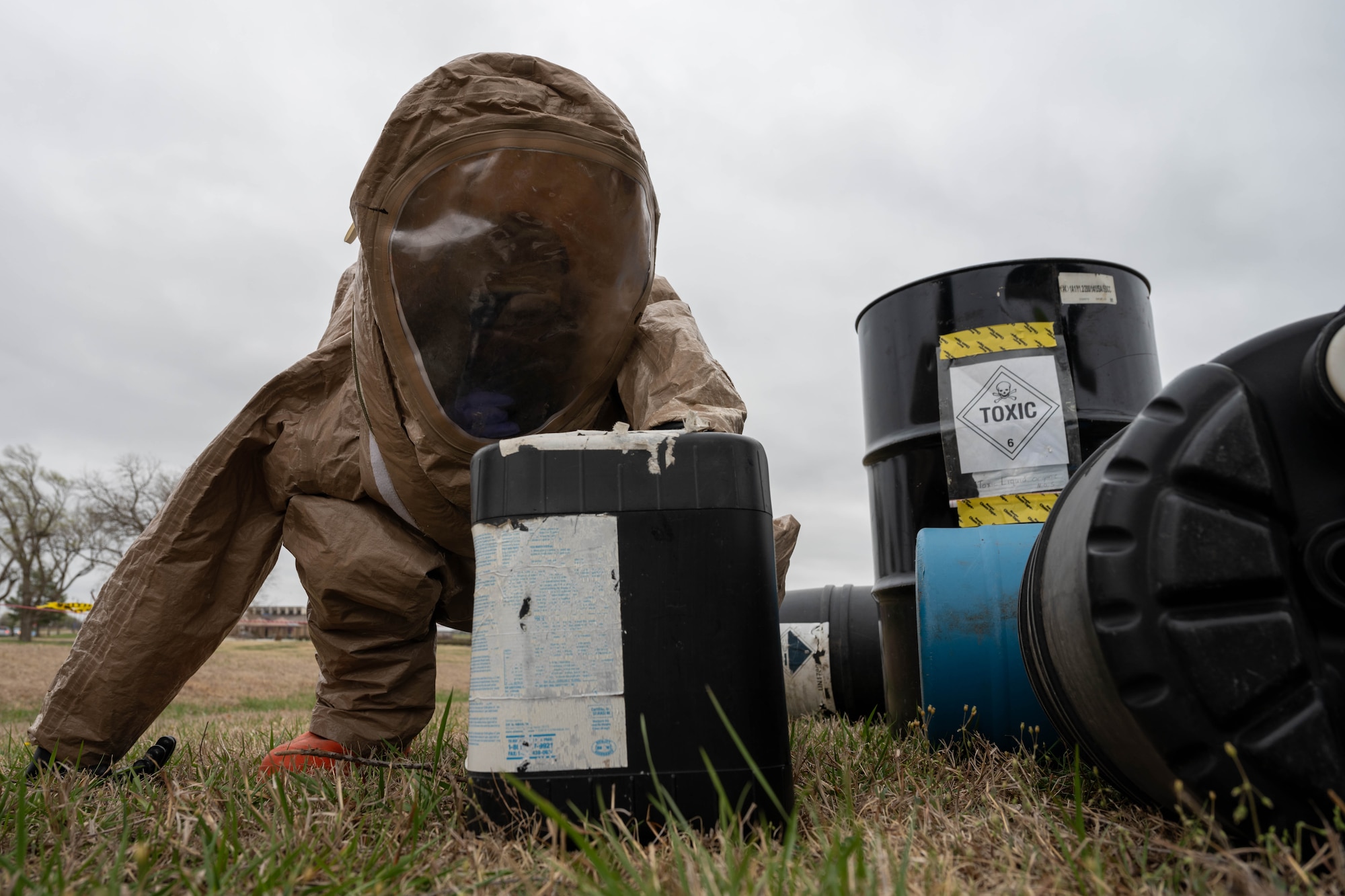 An Airman assigned to the 22nd Medical Group inspects a container of simulated hazardous material at McConnell Air Force Base, Kansas, March 28, 2025. The simulation was part of a collaborated training between 22nd MDG and Barton Community College. (U.S. Air Force photo by Airman 1st Class Patrick O’Neill)