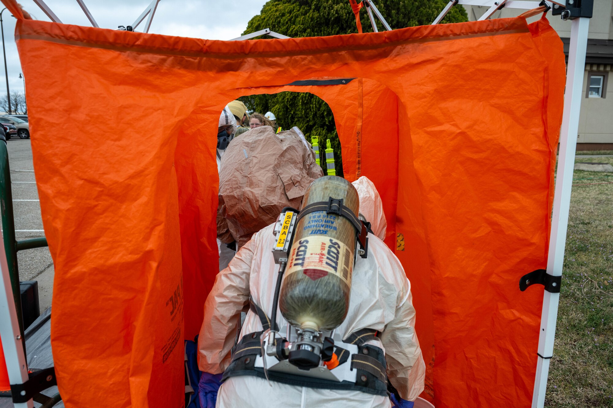 Team McConnell members assigned to the 22nd Medical Group use a decontamination shower at McConnell Air Force Base, Kansas, March 28, 2025. The shower was used during a class where simulated hazardous material was identified and removed from a controlled area. (U.S. Air Force photo by Airman 1st Class Patrick O’Neill)