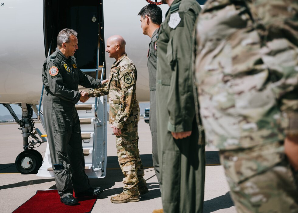Belgian Air Component Maj. Gen. Geert Decker (left), Belgium air chief, shakes hands with U.S. Air Force Brig. Gen. David Berkland (right), 56th Fighter Wing commander.