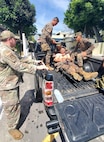 Master Sgt. Shane Bedard, Headquarters, 141st Air Refueling Wing, Washington Air National Guard talks with members of the El Salvador military as they conduct tactical combat casualty care training from Feb. 22 – March 8, 2025.