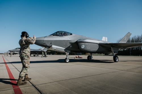 A crew chief launches a Royal Netherland Air Force F-35