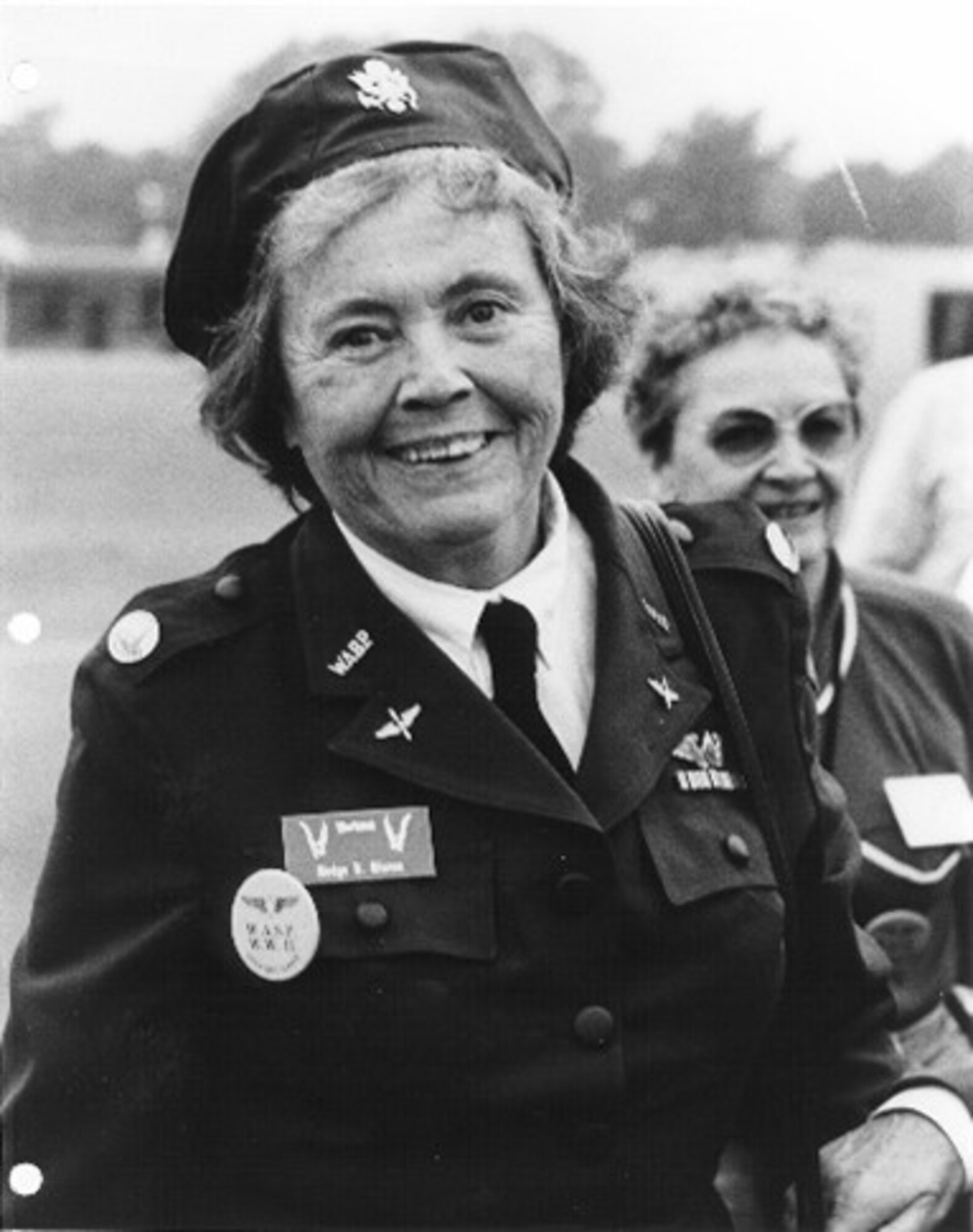 Woman stands in uniform
