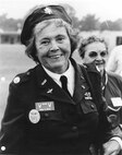 Woman stands in uniform