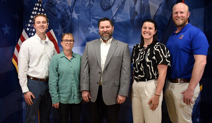 The deputy assistant secretary of the Army for research and technology names the U.S. Army Space and Missile Defense Command Technical Center’s distributed aperture research team a 2024 recipient of the Science and Technology Outstanding Technical Achievement Award. The team includes, from left: Andrew Vernetti, Korensia Siford, Dr. Russell Vela, Dr. Theresa Scarnati and Christopher Paulson. The award recognizes an individual or team whose outstanding contributions and achievements advanced the research or development accomplishments of the laboratory, group or project. (U.S. Army photo by Carrie David Campbell)