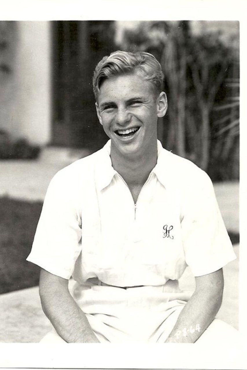 A tennis player poses for a photo.