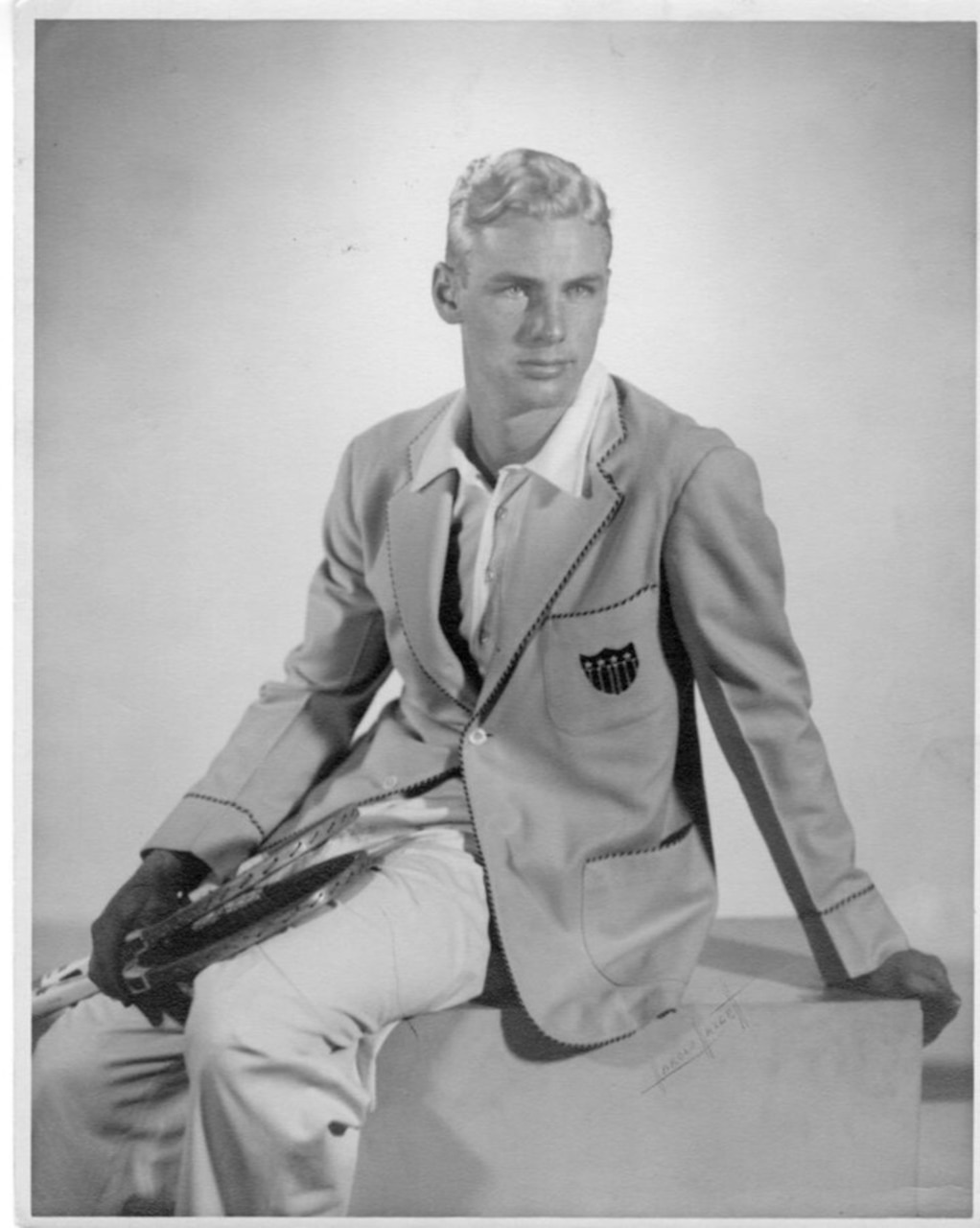 A tennis player poses for a photo.