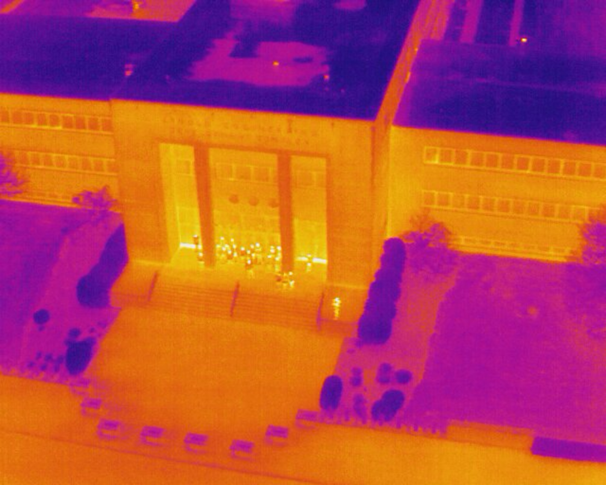 An infrared image of the Arnold Engineering Development Complex Administration and Engineering Building at Arnold Air Force Base, Tenn., is provided by a Small Unmanned Aircraft System, also known as an sUAS or a “drone,” during a March 5, 2025, demonstration of the device. The sUAS will soon be used at Arnold to perform asset health assessments. The device is equipped with both digital and infrared imaging capabilities and will be flown around installation buildings, plant facilities and associated equipment to ensure there are no compromises to such assets and to assess the structural integrity of facilities. (U.S. Air Force photo)