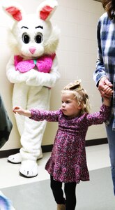 Two-year-old Ellie Upchurch of Mount Vernon gathers eggs with her great grandmother, Dr. Linda Upchurch, as the Easter Bunny observes.
