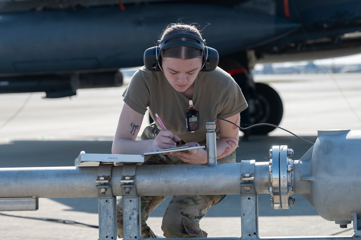 U.S. Airman 1st Class Autumn Garber writes in a book.