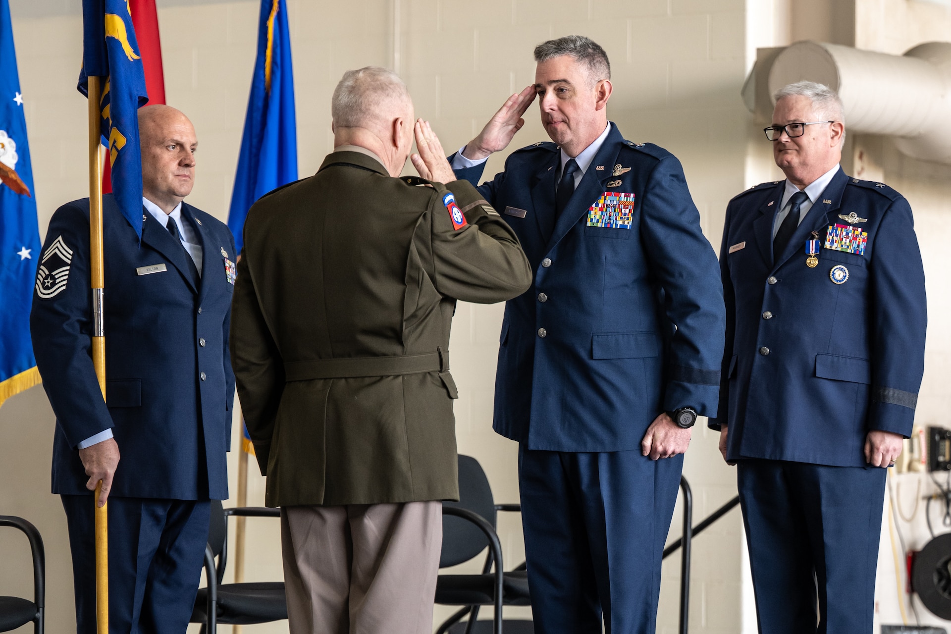 U.S. Air Force Brig. Gen. Bruce Bancroft, right, Kentucky’s new assistant adjutant general for Air, salutes U.S. Army Maj. Gen. Haldane Lamberton, adjutant general of the Commonwealth of Kentucky, during a change-of-command ceremony at the Kentucky Air National Guard Base in Louisville, Ky., March 14, 2025.