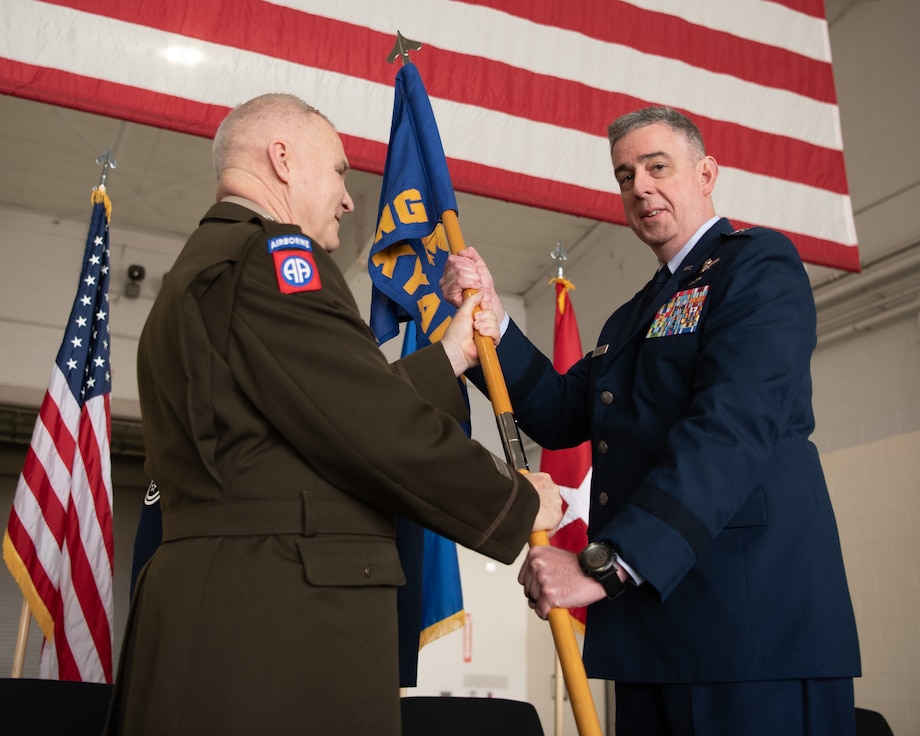 U.S. Air Force Brig. Gen. Bruce Bancroft, right, Kentucky’s new assistant adjutant general for Air, takes command of the Kentucky Air National Guard by accepting the organization’s guidon from U.S. Army Maj. Gen. Haldane Lamberton, adjutant general of the Commonwealth of Kentucky, during a ceremony at the Kentucky Air National Guard Base in Louisville, Ky., March 14, 2025.