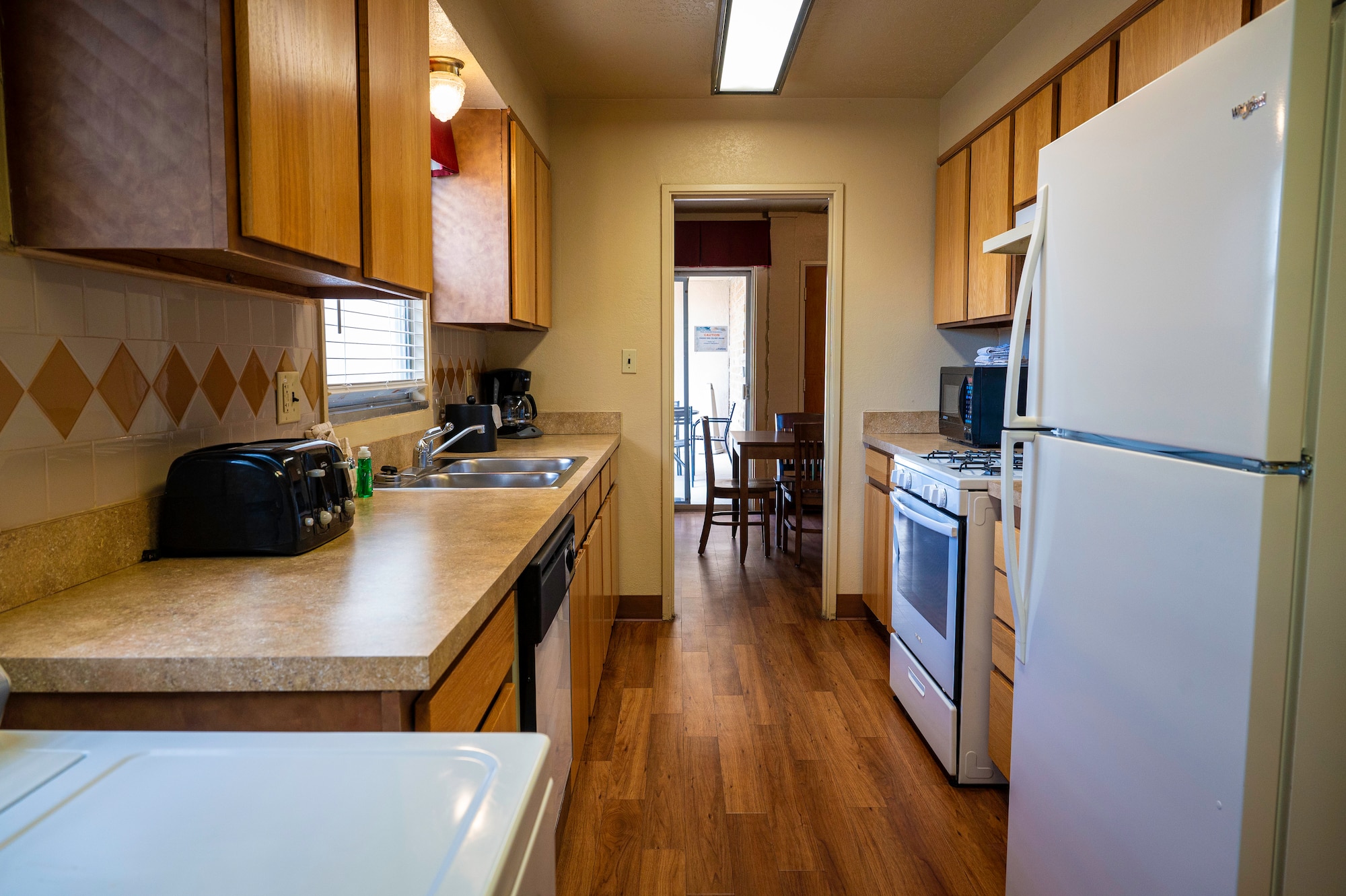 The newly renovated kitchen of a Temporary Lodging Facility unit