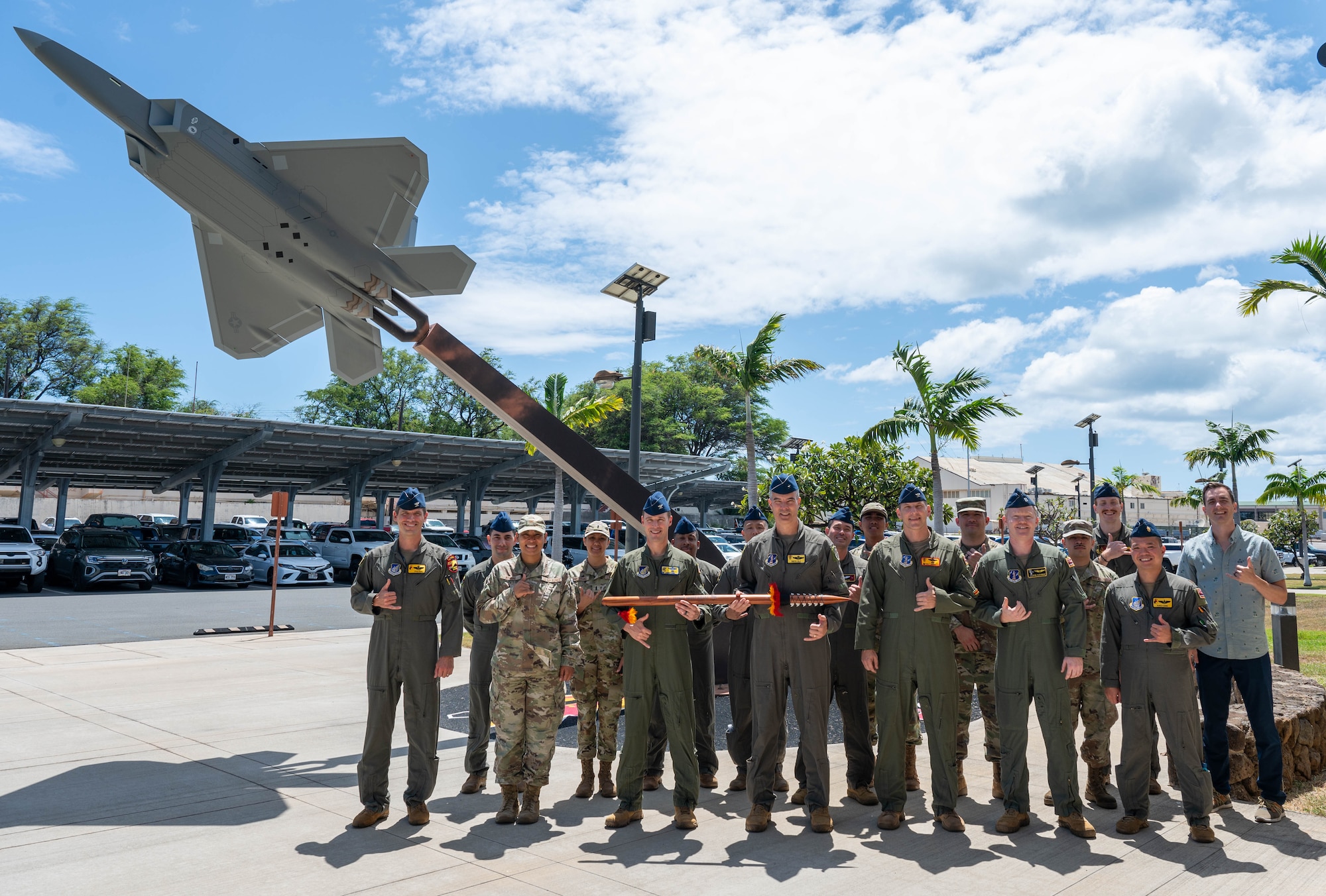 Group photo in front of a F-22 statue.
