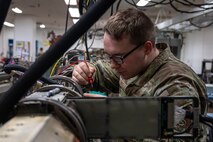 U.S. Air Force Senior Airman Alex Caldwell, 35th Maintenance Squadron avionics flight electronic warfare systems technician, works on an AN/ALQ-184 electronic countermeasures pod.