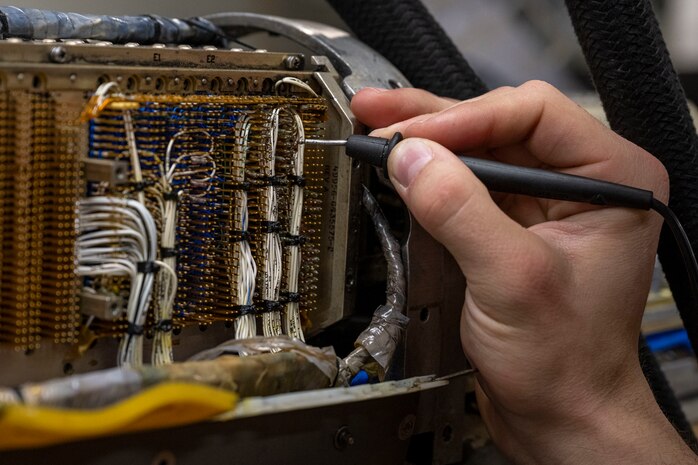 U.S. Air Force Senior Airman Gabriel Garner, 35th Maintenance Squadron avionics flight electronic warfare systems technician, works on an AN/ALQ-184 electronic countermeasures pod.