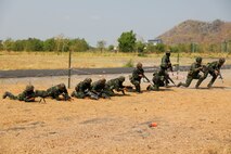 Members of the Royal Thai Army move across a simulated battlefield during Military Operations on Urbanized Terrain (MOUT) training with the U.S. Army on March 16, 2025, in Lop Buri, Thailand. MOUT is part of Hanuman Guardian 25, a bilateral training exercise to strengthen U.S. and Thai interoperability and readiness.