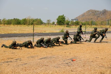 Members of the Royal Thai Army move across a simulated battlefield during Military Operations on Urbanized Terrain (MOUT) training with the U.S. Army on March 16, 2025, in Lop Buri, Thailand. MOUT is part of Hanuman Guardian 25, a bilateral training exercise to strengthen U.S. and Thai interoperability and readiness.