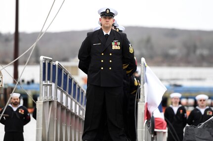 (April 5, 2025) – Sailors attached to the fast-attack submarine USS Iowa (SSN 797) man their newly commissioned submarine during a ceremony in Groton, Connecticut, April 5, 2025.