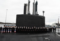 (April 5, 2025) – Sailors attached to the fast-attack submarine USS Iowa (SSN 797) man their newly commissioned submarine during a ceremony in Groton, Connecticut, April 5, 2025.