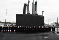 (April 5, 2025) – Sailors attached to the fast-attack submarine USS Iowa (SSN 797) man their newly commissioned submarine during a ceremony in Groton, Connecticut, April 5, 2025.