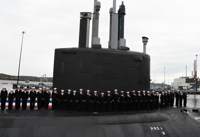 (April 5, 2025) – Sailors attached to the fast-attack submarine USS Iowa (SSN 797) man their newly commissioned submarine during a ceremony in Groton, Connecticut, April 5, 2025.