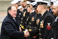 Secretary of the Navy John Phelan greets crewmembers attached to the fast-attack submarine USS Iowa (SSN 797) during a commissioning ceremony in Groton, Connecticut, April 5, 2025.