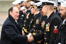 Secretary of the Navy John Phelan greets crewmembers attached to the fast-attack submarine USS Iowa (SSN 797) during a commissioning ceremony in Groton, Connecticut, April 5, 2025.