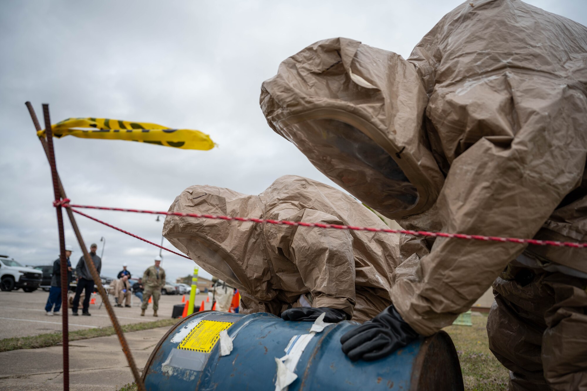 Two Airmen assigned to the 22nd Medical Group detect a leak from a container of simulated hazardous material at McConnell Air Force Base, Kansas, March 28, 2025. The simulation was part of a collaborated training between 22nd MDG and Barton Community College. (U.S. Air Force photo by Airman 1st Class Patrick O’Neill)