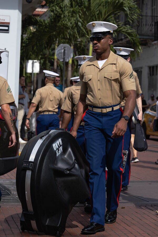 U.S. Marine Corps Sgt. Devin Davis, a trumpet instrumentalist with the Marine Forces Reserve Band, moves gear to a stage at the Town Square of Casco Antiguo, Panama, April 6, 2025. The Marine Forces Reserve Band will be performing throughout the week in support of expanded partnership between the U.S. and Panama. (U.S. Marine Corps photo by Lance Cpl. Van Hoang)