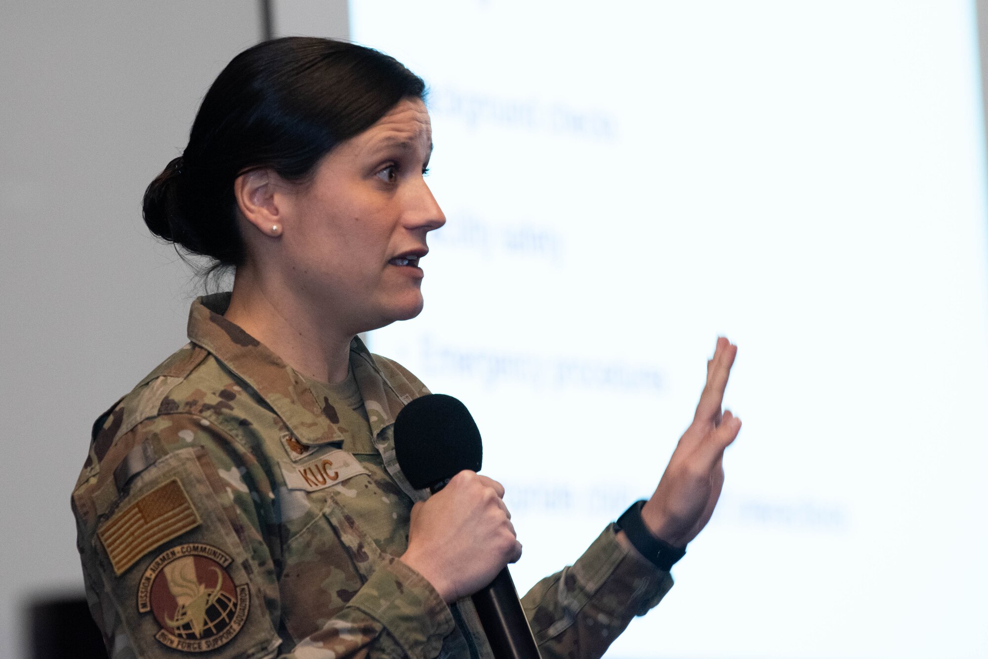 Force Support Squadron commander speaks during conference.