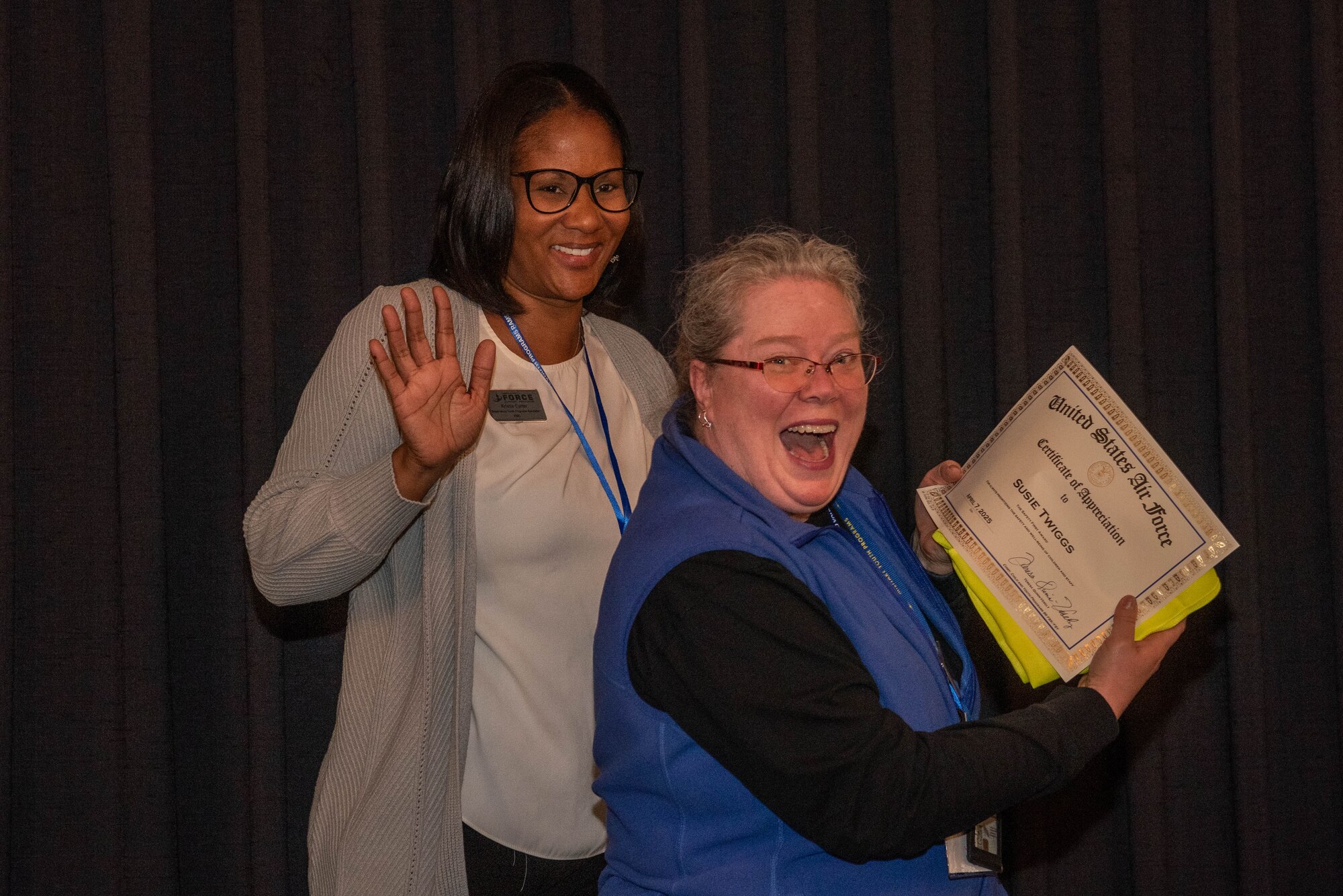 Certificate winner poses with supervisor.