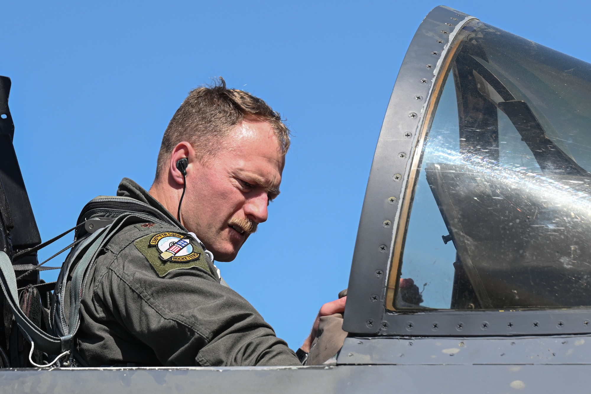 U.S. Air Force Maj. Tray Timmerman, 336th Fighter Squadron pilot, prepares for takeoff in an F-15E Strike Eagle, at Seymour Johnson Air Force Base, North Carolina, March 26, 2025. Conducting pre-flight checks is vital to the safety of the aircrew before the flight. (U.S. Air Force photo by Airman Holly Leonard)