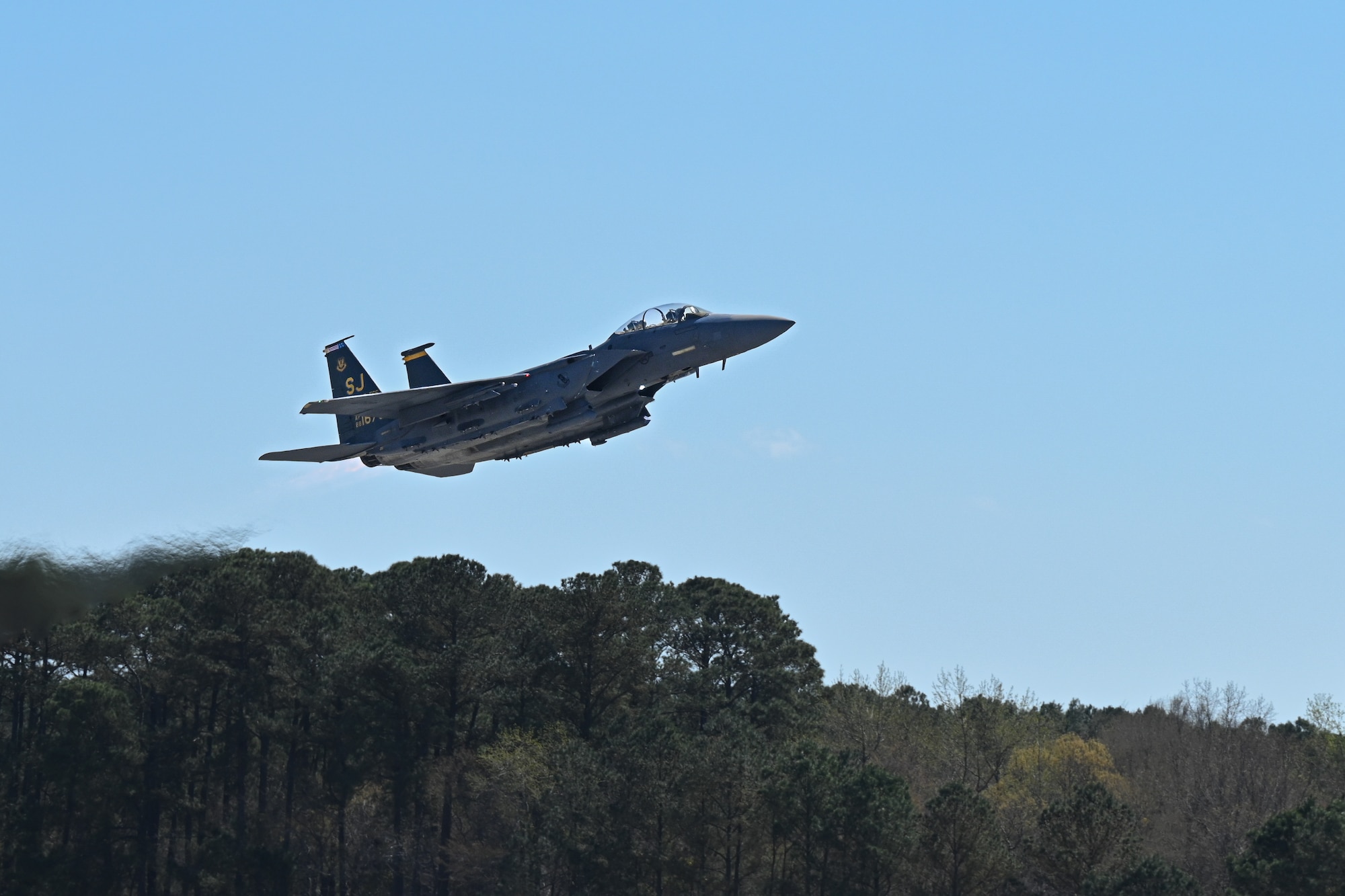 A U.S. Air Force F-15E Strike Eagle assigned to the 336th Fighter Squadron takes off from the runway, at Seymour Johnson Air Force Base, North Carolina, March 26, 2025. Conducting pre-flight checks is vital to the safety of the aircrew before the flight. (U.S. Air Force photo by Airman Holly Leonard)