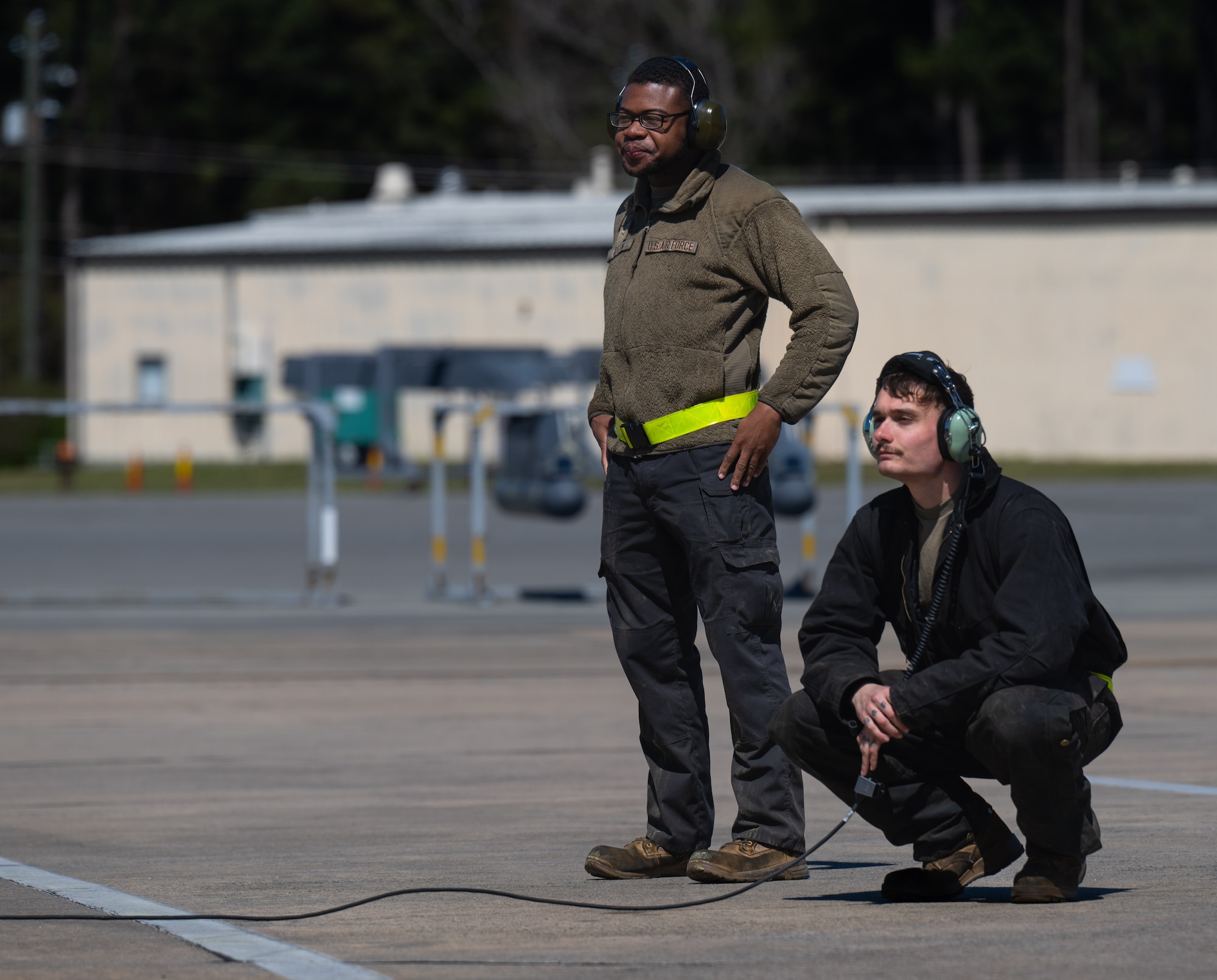 U.S. Air Force Airman 1st Class Bobbie Griffin, left, and Airman 1st Class Trey Davies, right, 336th Fighter Generation Squadron crew chiefs, conduct a pre-flight inspection at Seymour Johnson Air Force Base, North Carolina, March 26, 2025. Conducting pre-flight checks is vital to the safety of the aircrew. (U.S. Air Force photo by Airman 1st Class Rebecca Tierney)