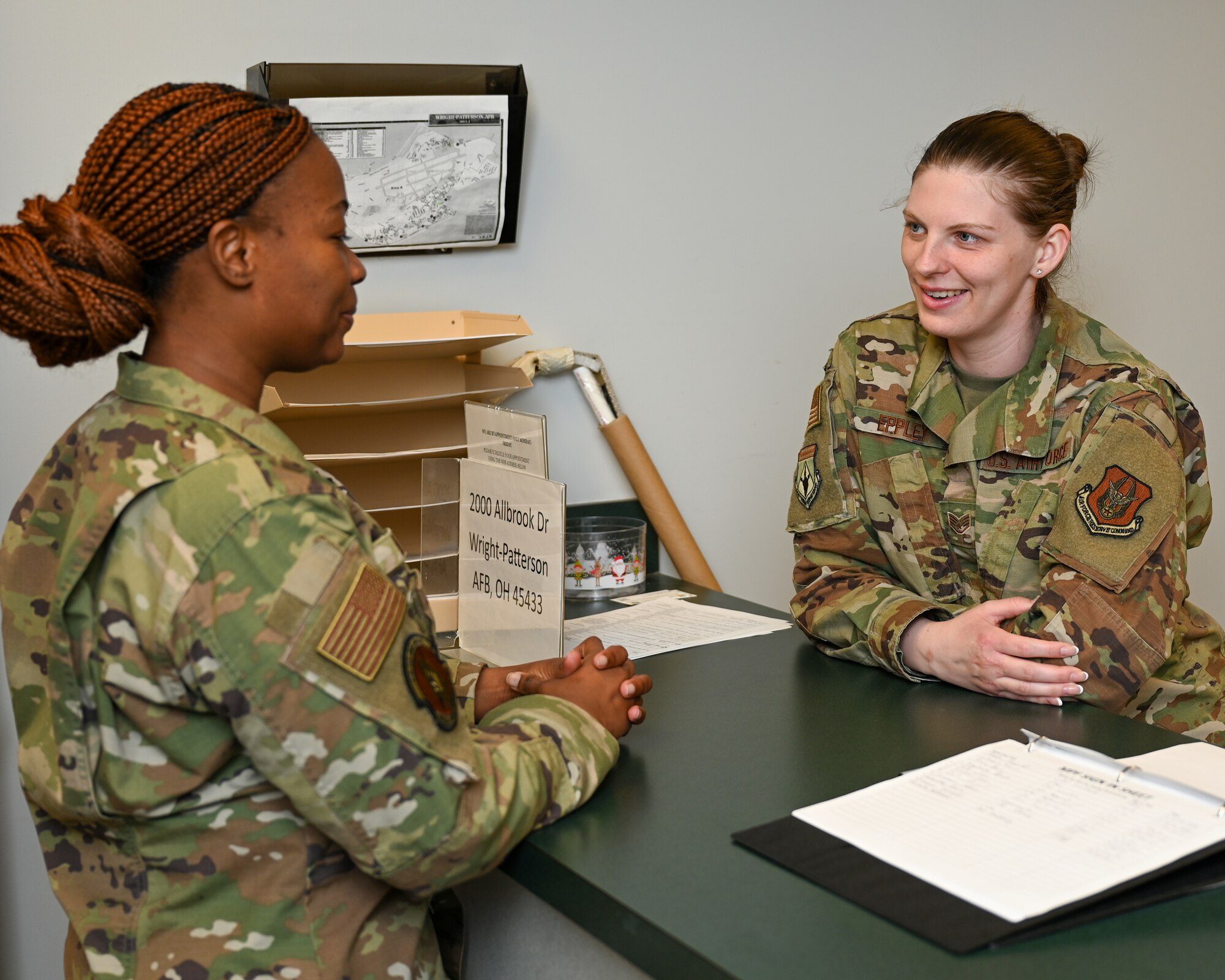 Staff Sgt. Alexis Eppley, 445th Mission Support Group commanders support staff technician, reviews customer support topics with Airman Basic Valmir Lorwy, 445th Force Support Squadron personnel specialist, at Wright-Patterson Air Force Base, March 20, 2025.