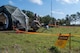 People working on a satellite dish and tactical communications tools during a training exercise.