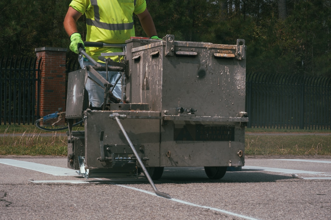 New rumble strips are laid at the Holcomb Gate on Marine Corps Base Camp Lejeune, North Carolina, April 5, 2025. As part of a broader effort to increase driver safety at Marine Corps Base Camp Lejeune and Marine Corps Air Station New River, rumble strips are being added to roadways. The strips serve as an additional safety measure that will alert drivers to the presence of active vehicle barrier systems, which can be deployed any time. (U.S. Marine Corps photo by Staff Sgt. Andrew Skiver)