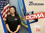 Smiling female wears a black DCMA shirt