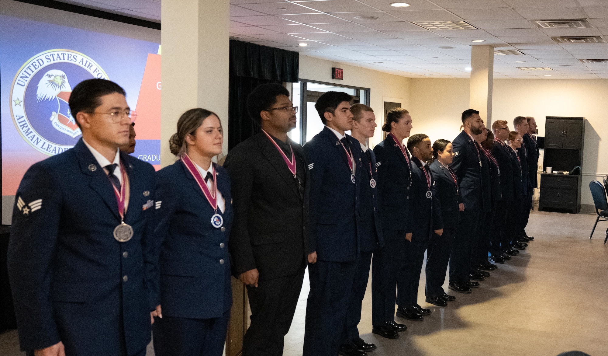 Graduates from Airman Leadership School Class 25-C stand in formation during their graduation ceremony at Laughlin Air Force Base, Texas, April 3, 2025. The class, hosted by Goodfellow AFB instructors, marked the return of ALS to Laughlin after more than a decade. (U.S. Air Force photo by Airman 1st Class Harrison Sullivan)