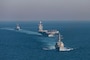 The Arleigh Burke-class guided missile destroyers USS Winston S. Churchill (DDG 81) (front) and USS Bainbridge (DDG 96) (back) escort the world’s largest aircraft carrier, USS Gerald R. Ford (CVN 78), during an integrated phase training event, March 23, 2025.