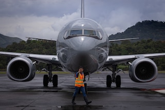 A U.S. Marine Corps C-40A aircraft with Marine Transport Squadron (VMR) 1, 4th Marine Aircraft Wing, is guided by a Panamanian civilian contractor at the Panamá Pacífico Airfield, Panama, April 5, 2025. 4th MAW transports personnel in support of an expanded security and community relationship efforts between the U.S. and Panama. (U.S. Marine Corps photo by Lance Cpl. Van Hoang)