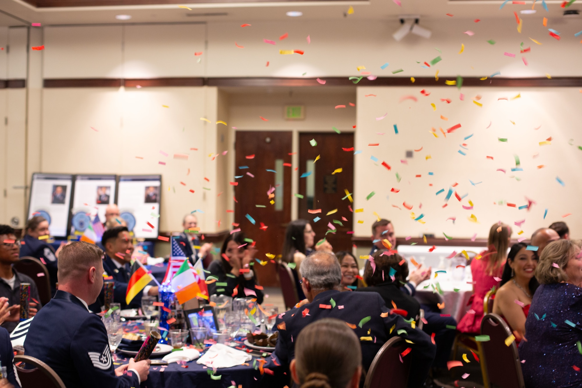Members celebrating at the ceremony with confetti being thrown.