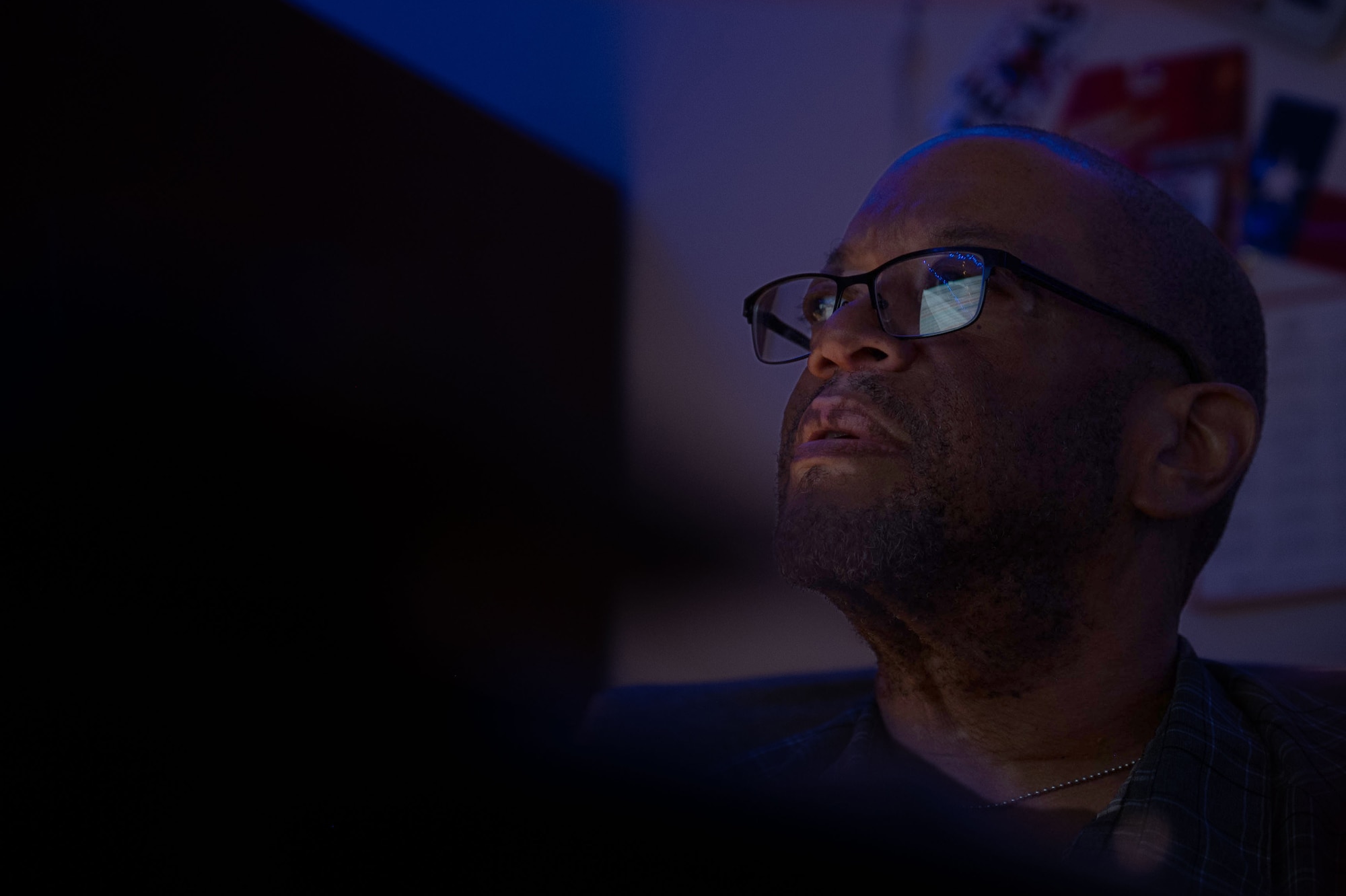 A man looks at a computer.