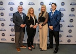 Naval Surface Warfare Center Panama City Division (NSWC PCD) employees (from left) Cory Bruckschen, Rachel Thompson, Jenica Lolley, and Tristan Dickinson, designed and implement the first Civilian Payroll Missing Time & Attendance and Unapproved Time Report process Robotic Process Automation (RPA) Robot (BOT). The team was also awarded the NSWC PCD FY24 Excellence in Business Innovation Annual Award. (U.S. Navy photo by Ronnie Newsome)