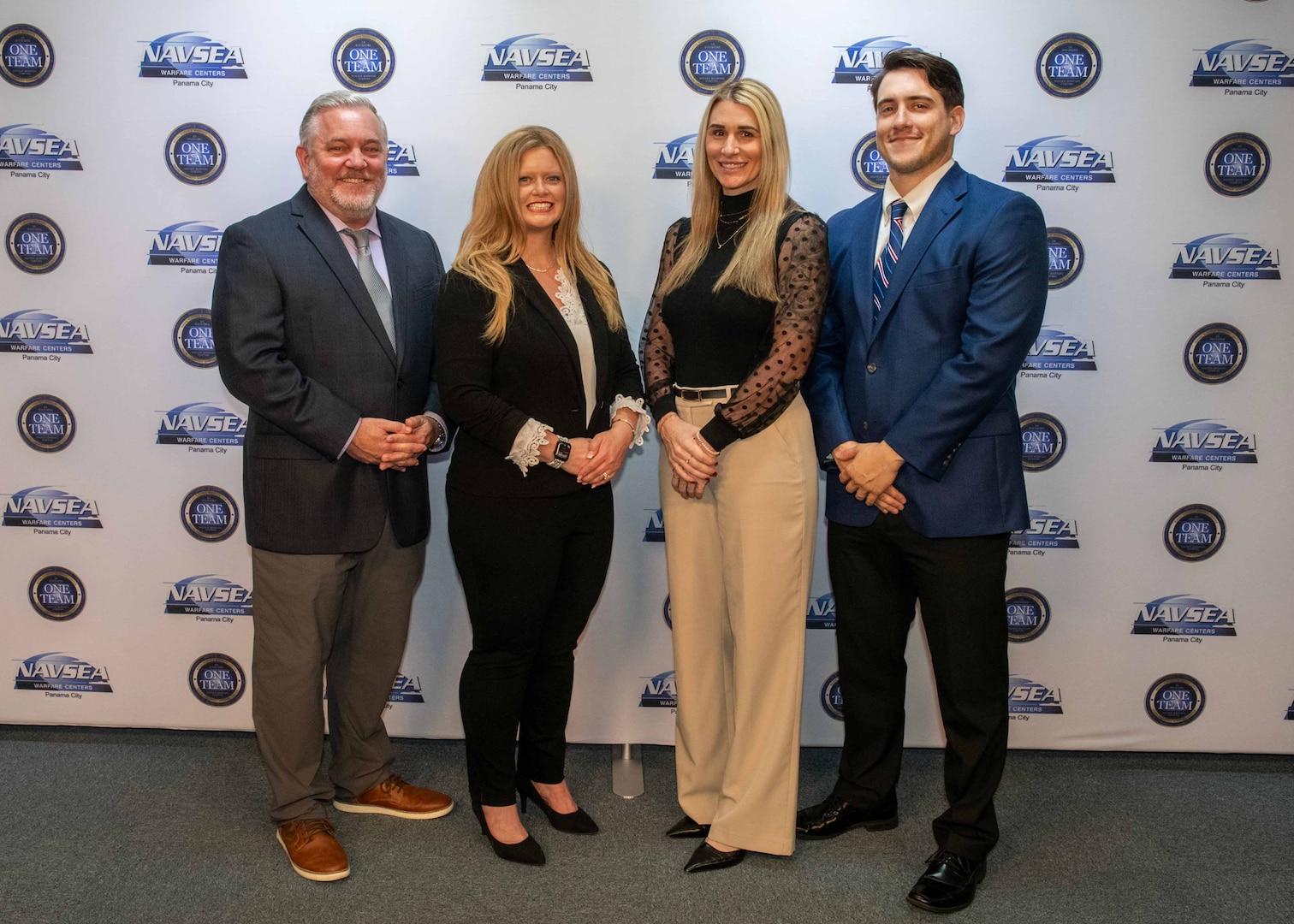Naval Surface Warfare Center Panama City Division (NSWC PCD) employees (from left) Cory Bruckschen, Rachel Thompson, Jenica Lolley, and Tristan Dickinson, designed and implement the first Civilian Payroll Missing Time & Attendance and Unapproved Time Report process Robotic Process Automation (RPA) Robot (BOT). The team was also awarded the NSWC PCD FY24 Excellence in Business Innovation Annual Award. (U.S. Navy photo by Ronnie Newsome)