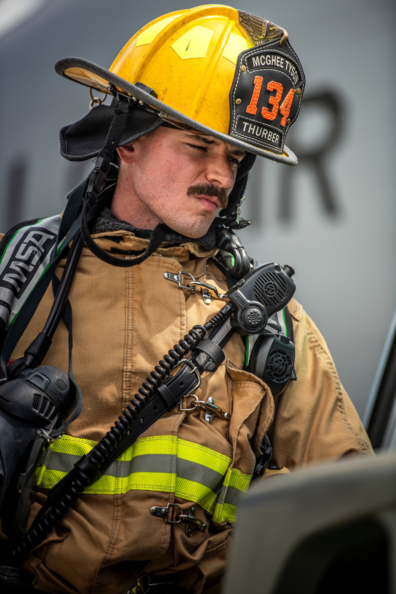 U.S. Air National Guard Staff Sgt. Jacob Thurber, 134th Civil Engineer Squadron firefighter, inspects a mock fuel spill during a training exercise on McGhee Tyson Air National Guard Base, Tennessee.