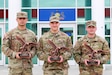 Sgt. Daniel Miller, center, of the 166th Regiment – Regional Training Institute won Noncommissioned Officer of the Year; Spc. Robert Ruiz, left, of the 28th Expeditionary Combat Aviation Brigade won Soldier of the Year; and Sgt. 1st Class Tyler Landis, right, of the Pennsylvania Army National Guard Recruiting and Retention Battalion won the Command Sgt. Maj. Jay H. Fields NCO Leadership Award at the Pennsylvania Army National Guard’s state-level best warrior competition at Fort Indiantown Gap, Pa. April 3–6, 2025. (U.S. Army National Guard photo by )