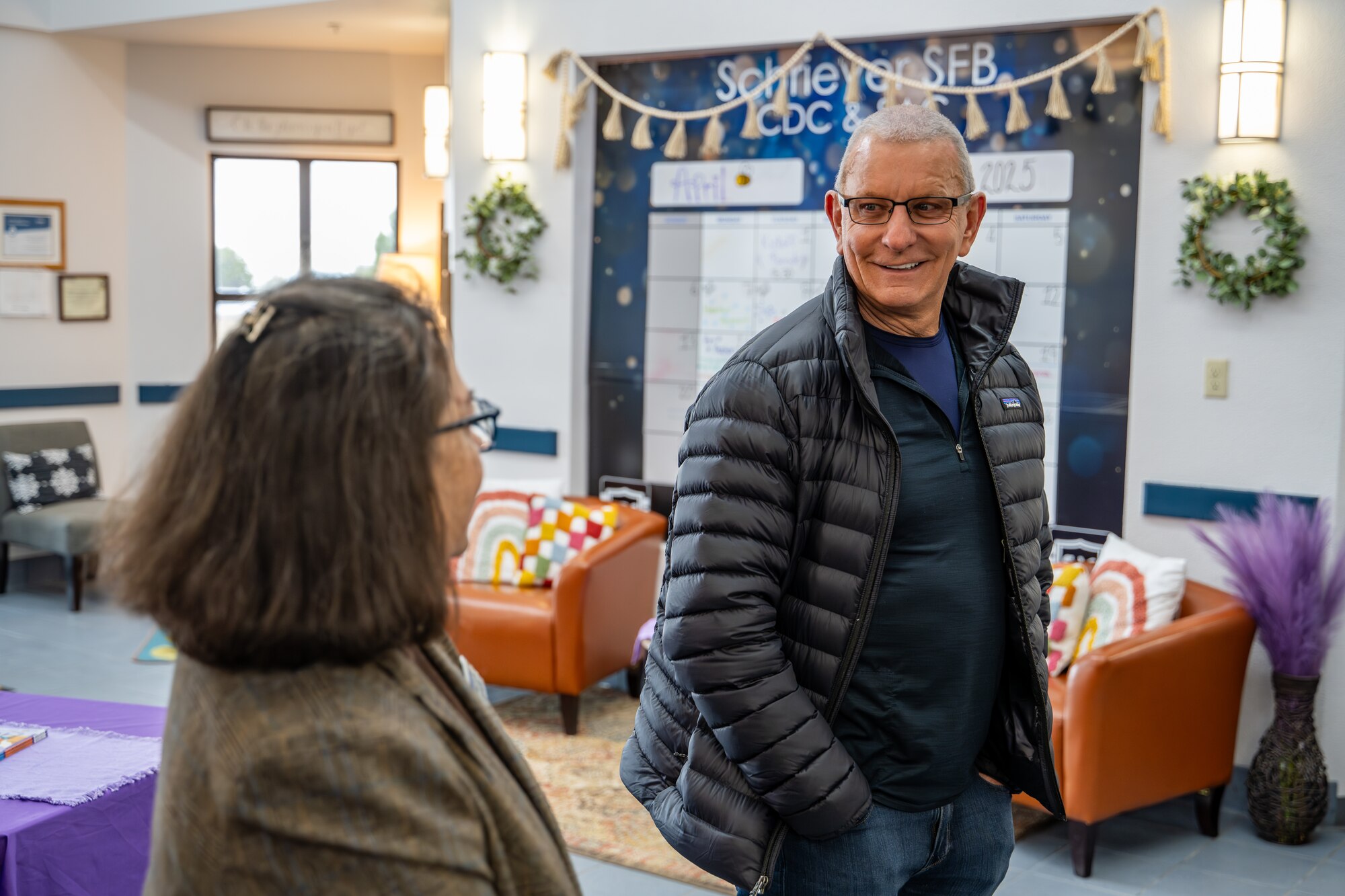 Celebrity chef Robert Irvine discusses his thoughts on the menu served at the Child Development Center with Tamara Finnerty, 50th Force Support Squadron CDC assistant director, at Schriever Space Force Base, Colorado, April 3, 2025. During his visit to Schriever SFB, Chef Irvine and the Robert Irvine Foundation toured the CDC kitchen and the base dining facility, The Dish, to engage with Guardians, Airmen, and staff. (U.S. Space Force photo by Dalton Prejeant)