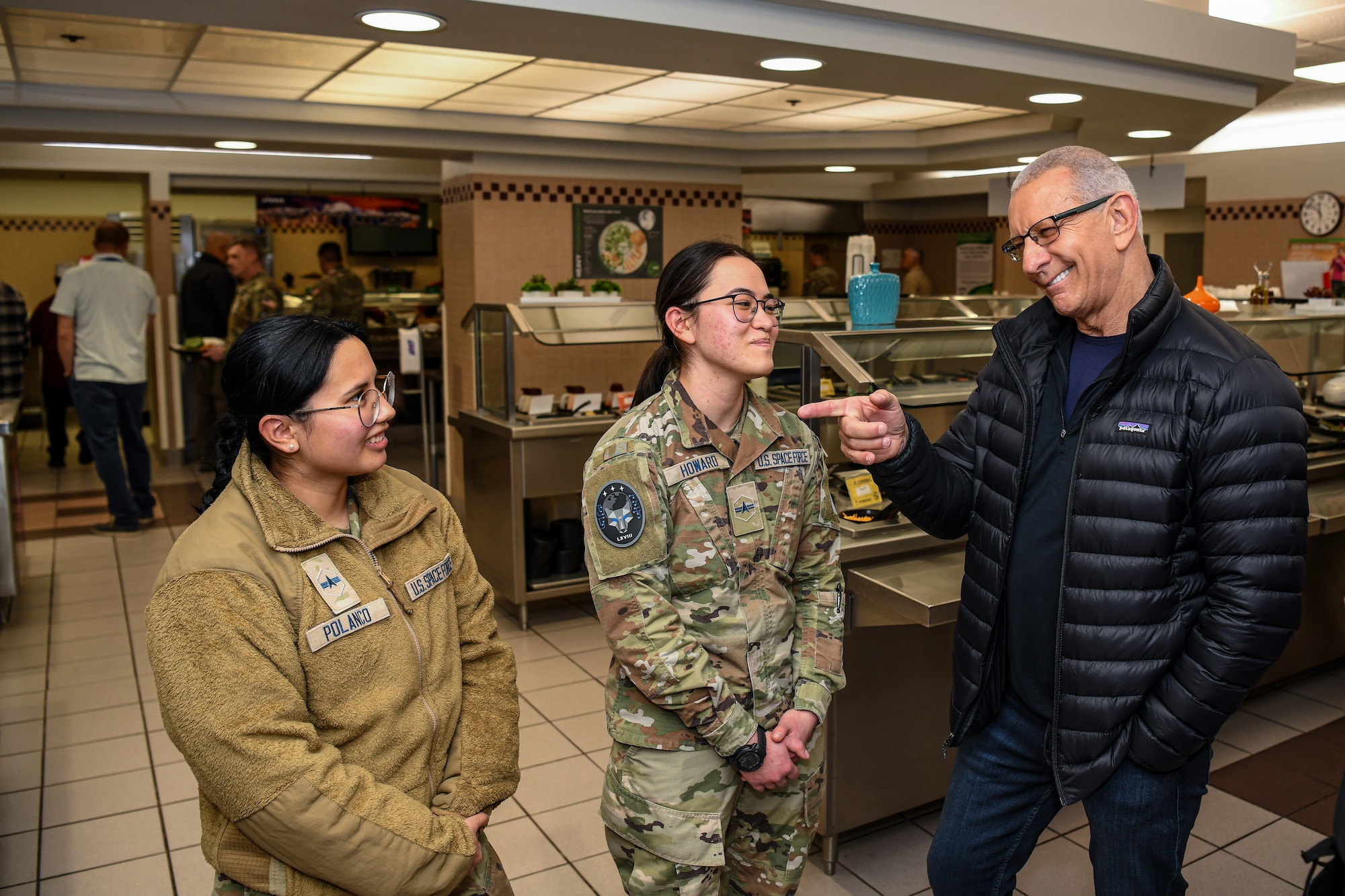 Celebrity chef Robert Irvine talks with Guardians during a visit of the base dining facility at Schriever Space Force Base, Colorado, April 3, 2025. During his visit to Schriever SFB, Irvine and the Robert Irvine Foundation toured the Child Development Center kitchen and The Dish to engage with Guardians, Airmen, and staff. (U.S. Space Force photo by Dalton Prejeant)