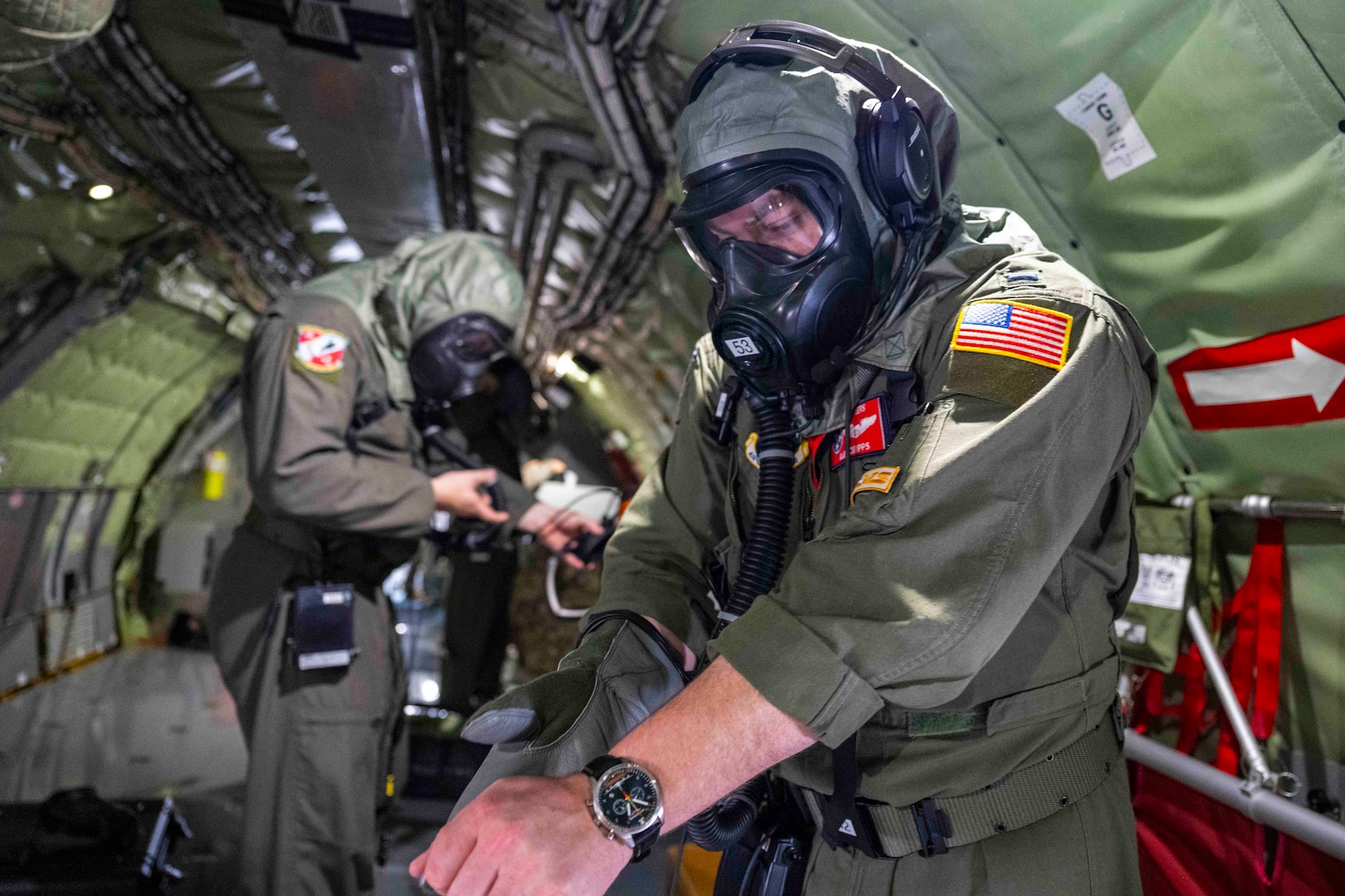 U.S. Air National Guard Airmen assigned to the 134th Air Refueling Wing put on protective gear inside a KC-135R Stratotanker during a training exercise, April 6, 2025 at McGhee Tyson Air National Guard Base, Tennessee.